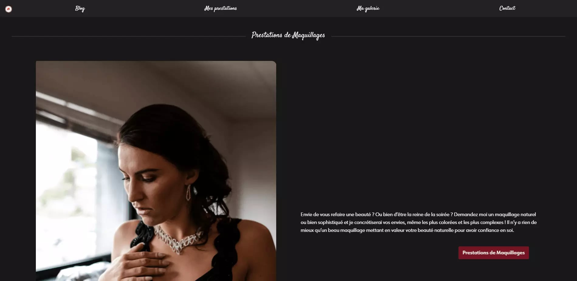 A close-up of a woman with dark hair and a contemplative expression, wearing makeup and a decorative necklace.