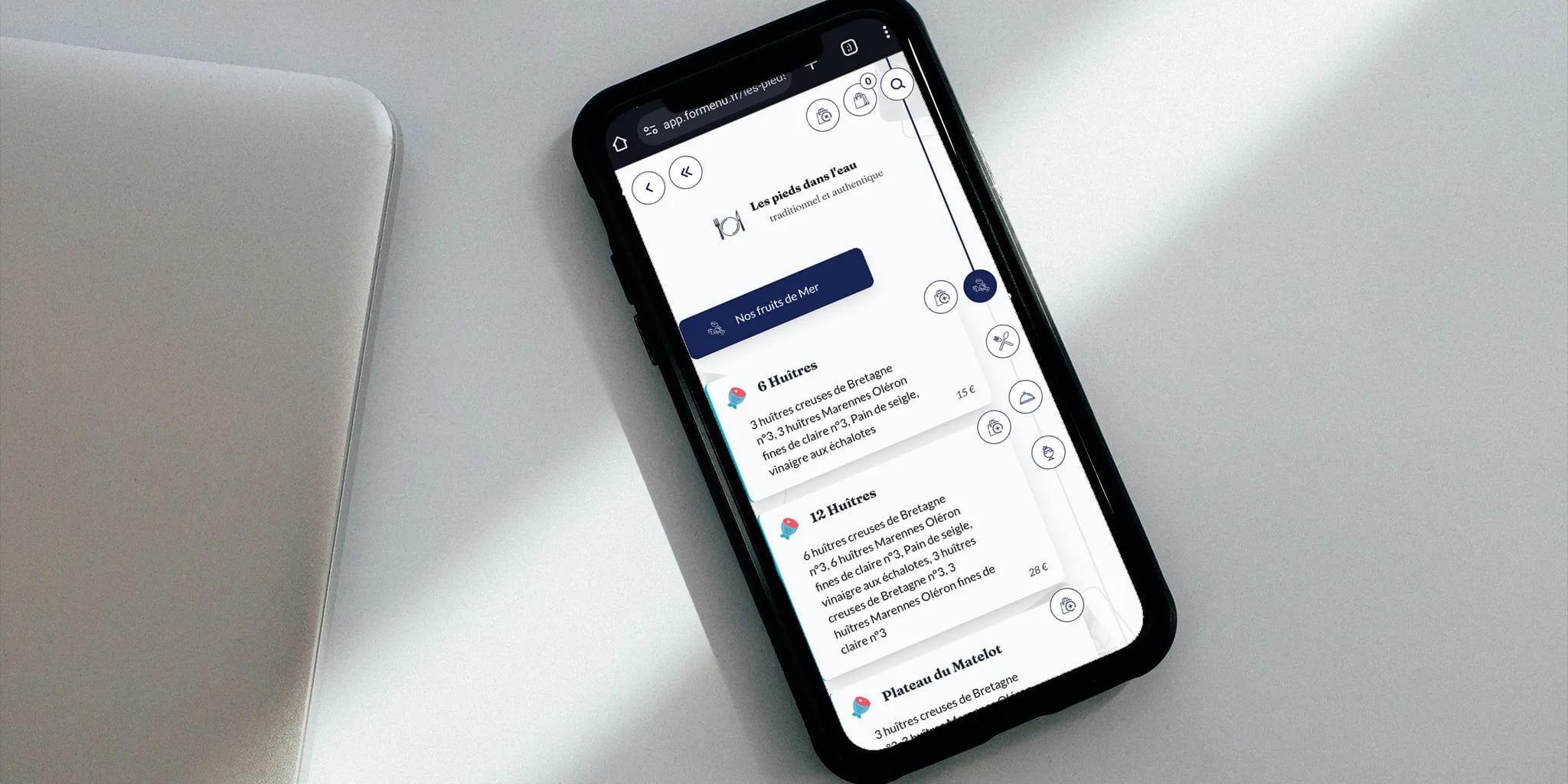 Smartphone displaying a seafood menu on white surface